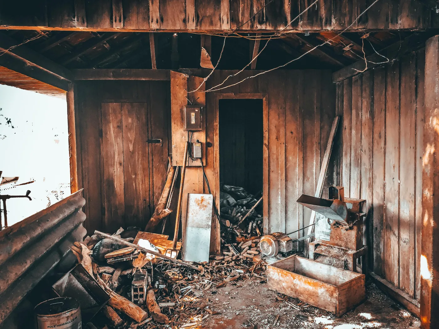 Cluttered abandoned interior with piles of debris ready for a full house cleanout